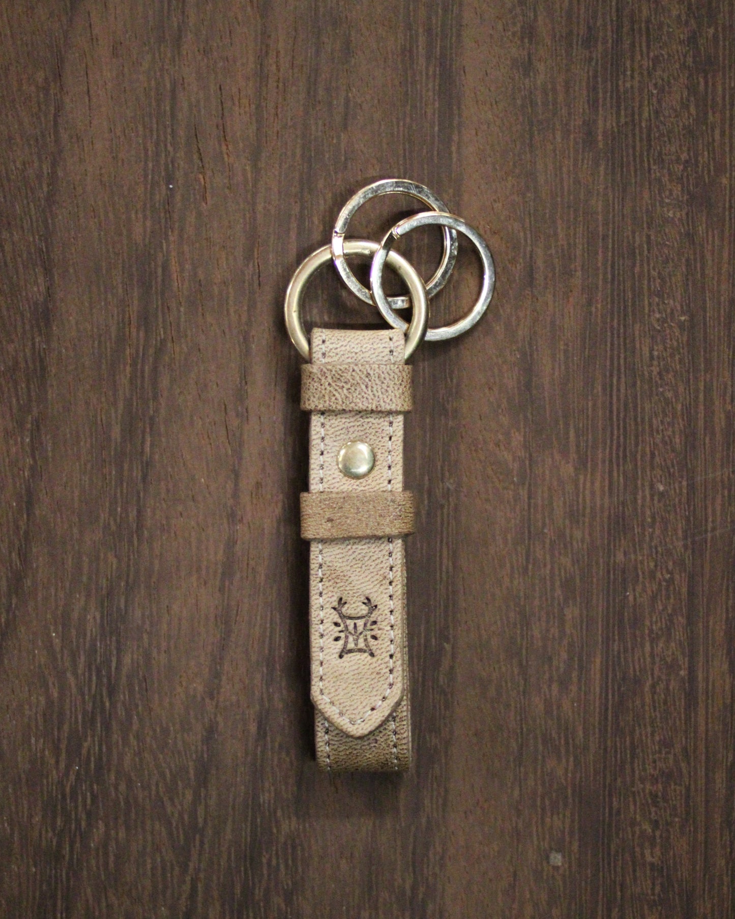 Bay Tine Tannery acorn-shaped key fob with metal keyring, designed for everyday use and key organization.