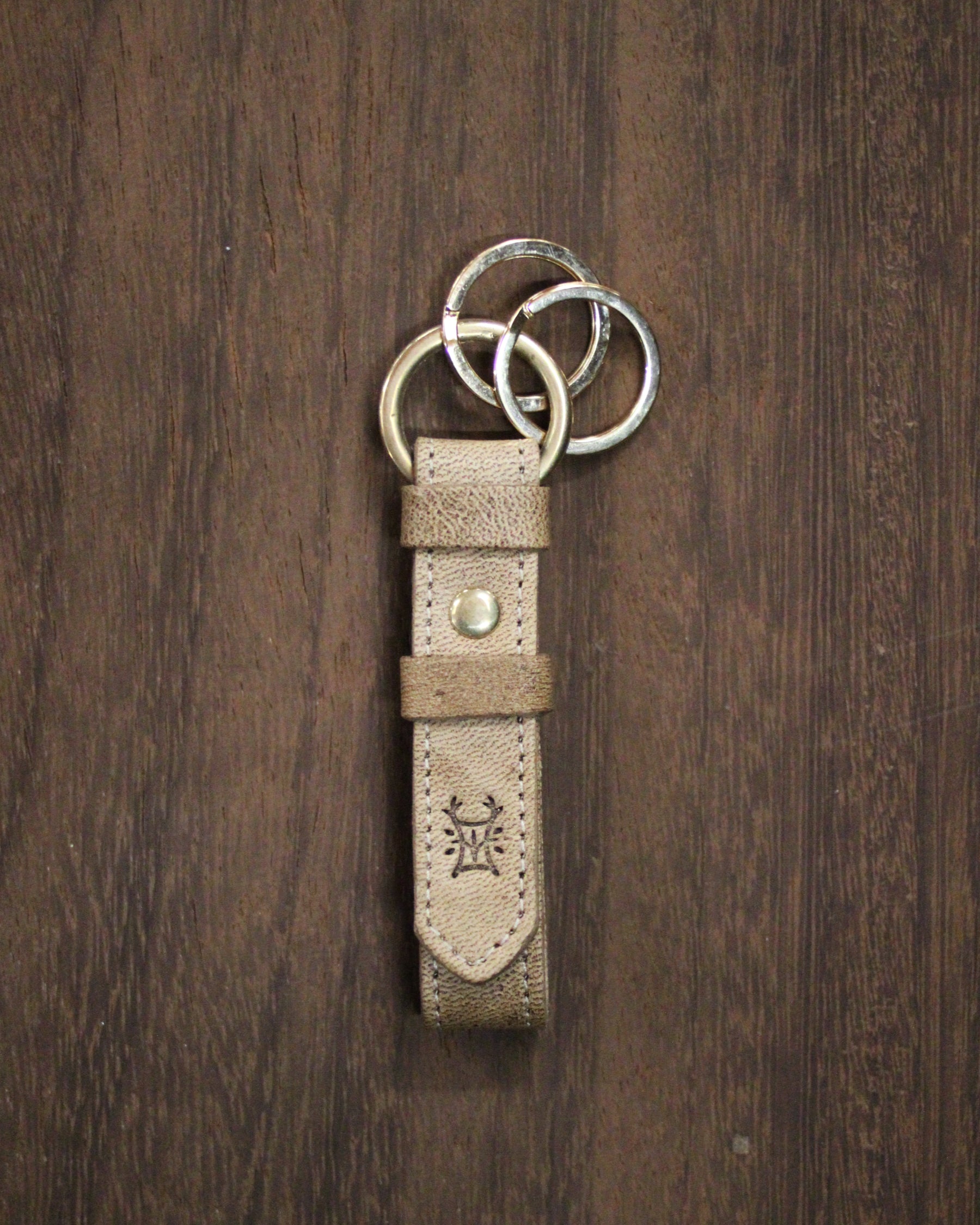 Bay Tine Tannery acorn-shaped key fob with metal keyring, designed for everyday use and key organization.