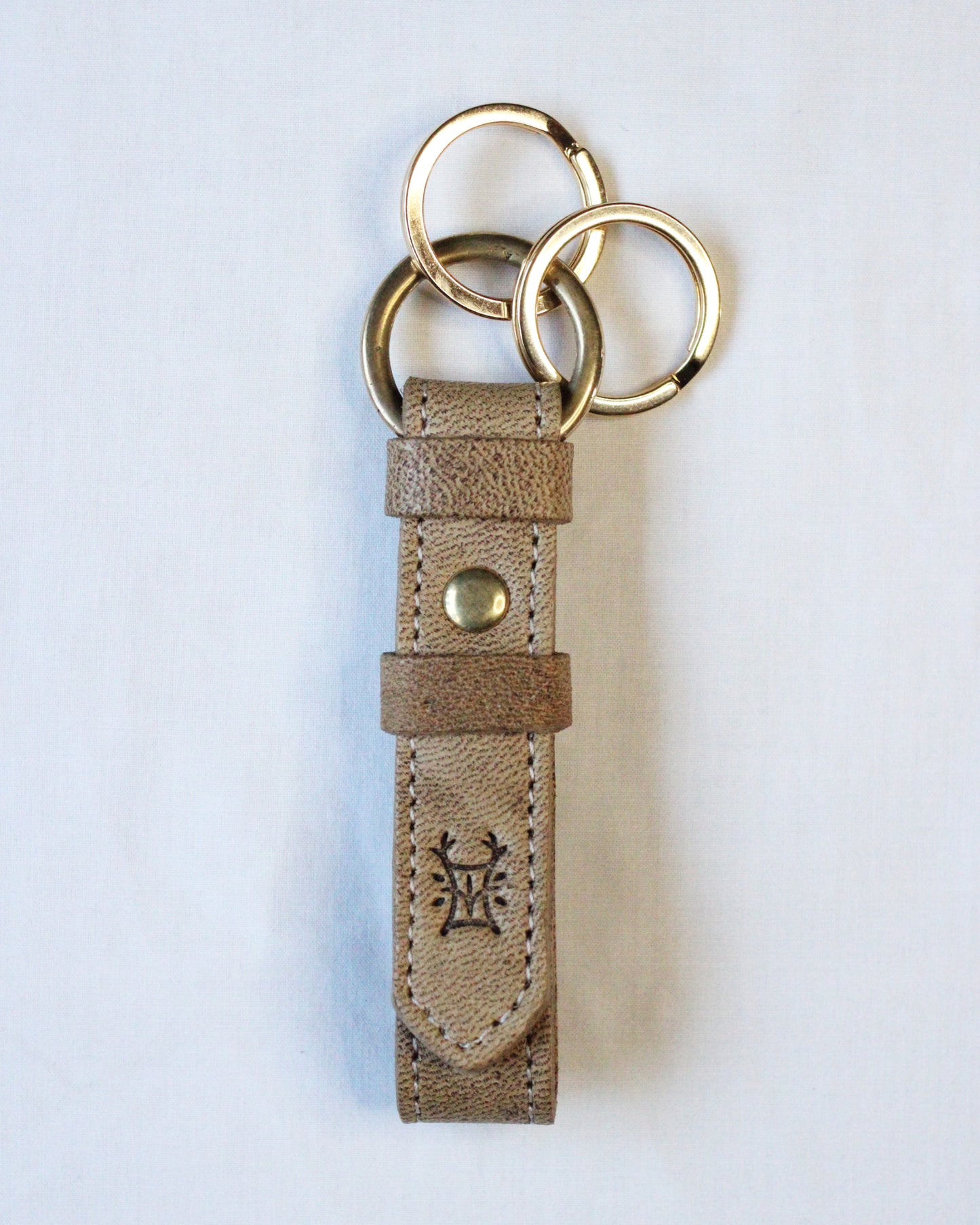 Bay Tine Tannery Acorn key fob with detailed leather craftsmanship and metal key ring, designed for key organization and style.