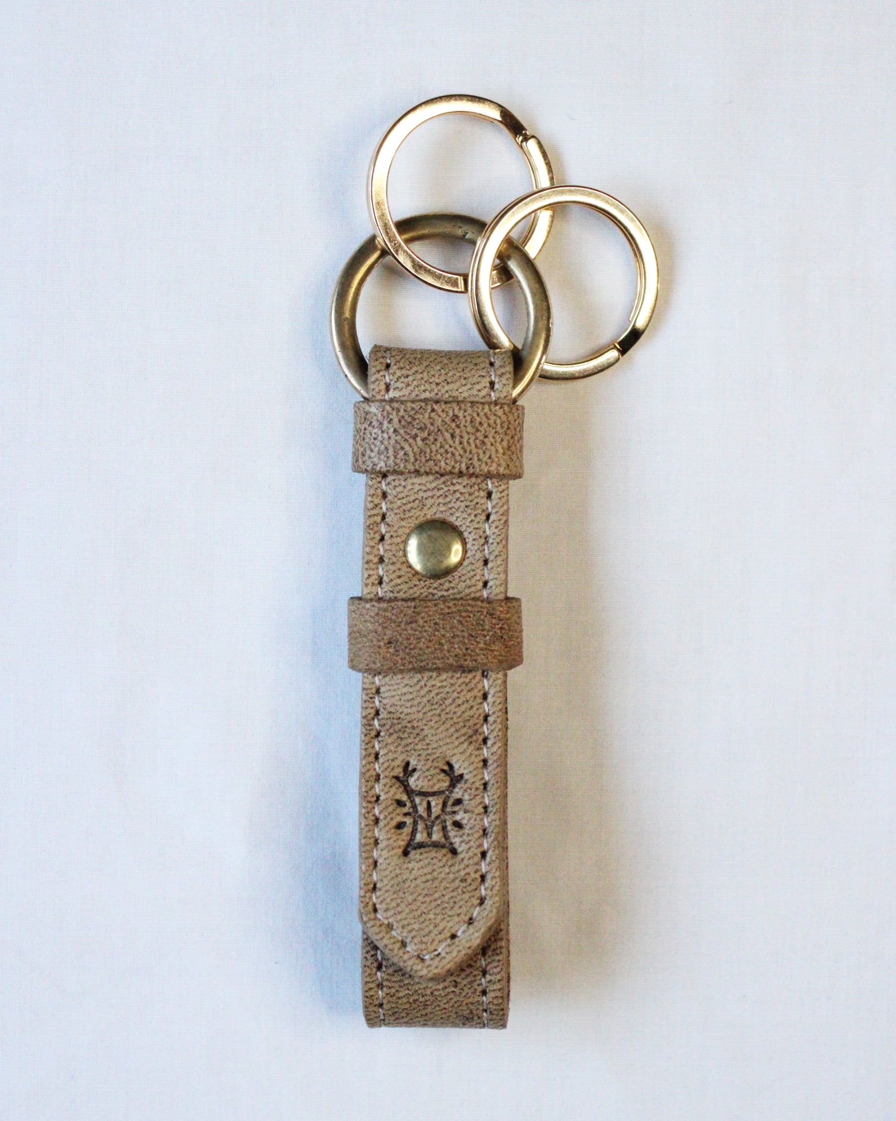 Bay Tine Tannery Acorn key fob with detailed leather craftsmanship and metal key ring, designed for key organization and style.