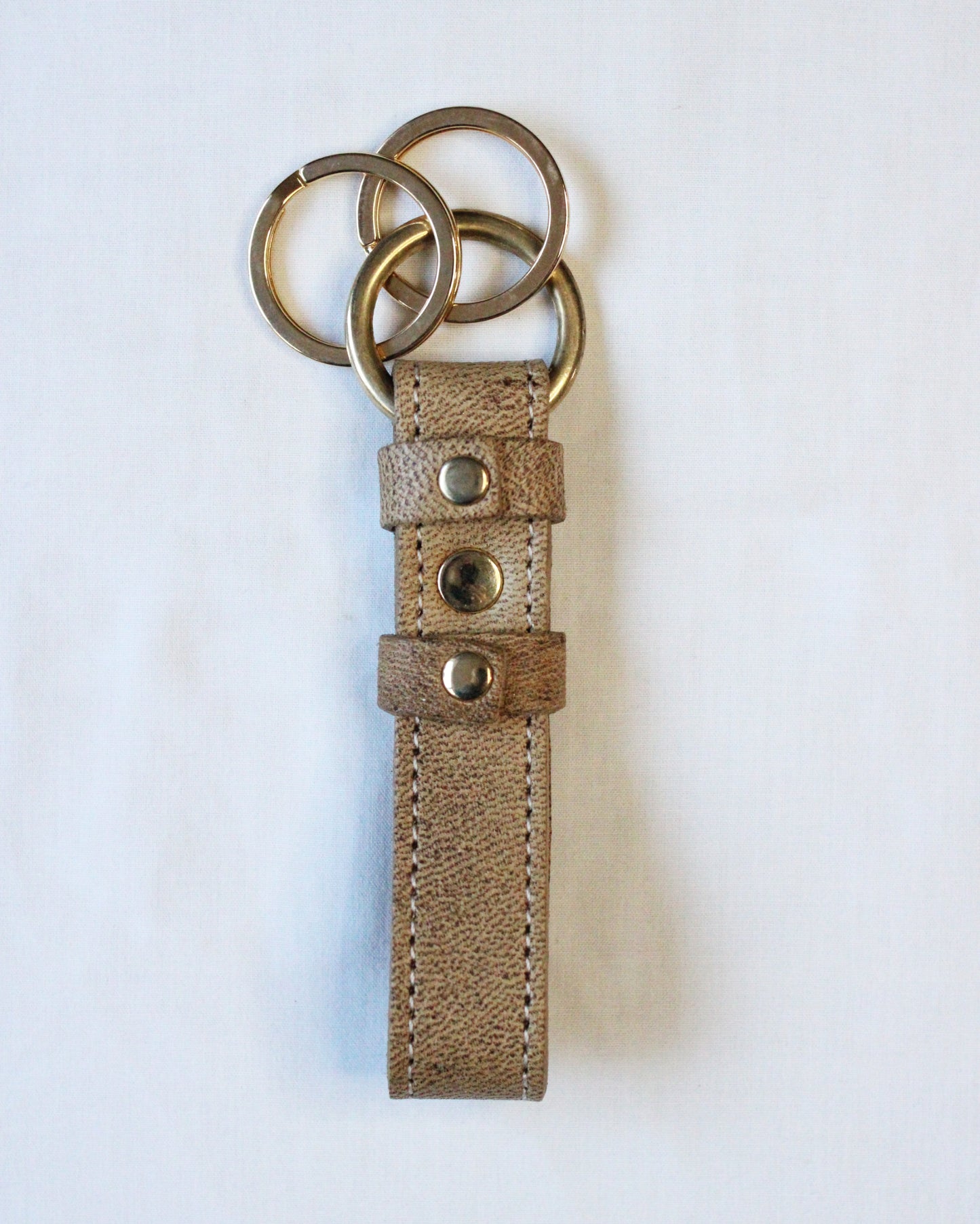 Bay Tine Tannery Acorn key fob with leather and metal details, showcasing a stylish, compact key accessory.