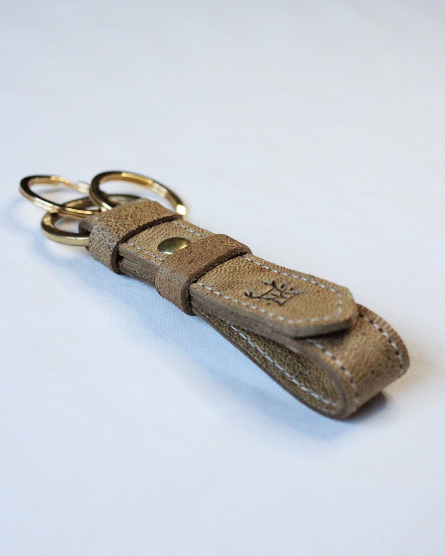 Bay Tine Tannery Acorn key fob with metal keyring and leather detailing, designed for secure key organization.