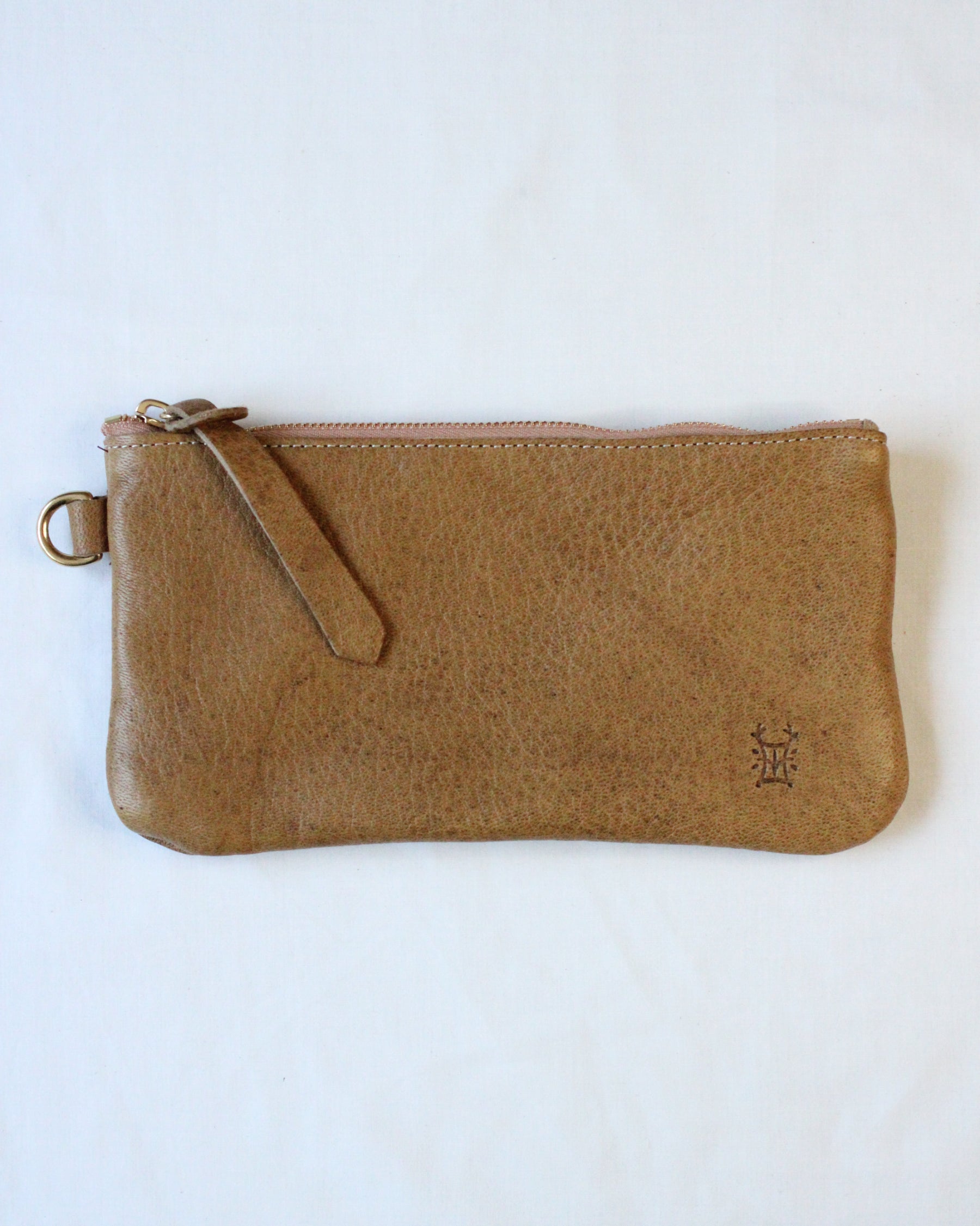 Brown leather zip pouch with an acorn design from BAY TINE TANNERY, featuring a compact and stylish storage accessory.
