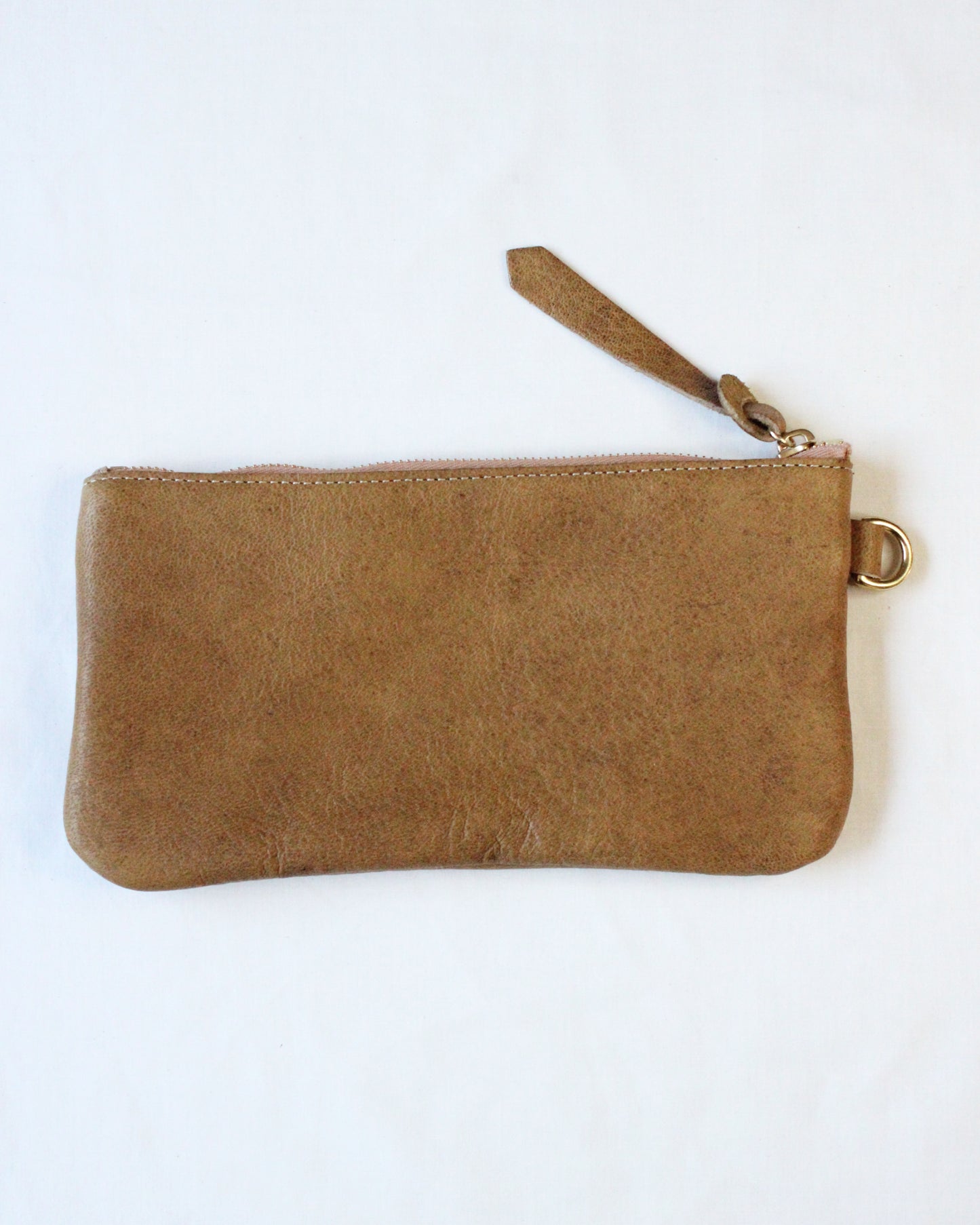 Brown acorn-shaped zip pouch from BAY TINE TANNERY featuring a secure zipper closure and compact design.