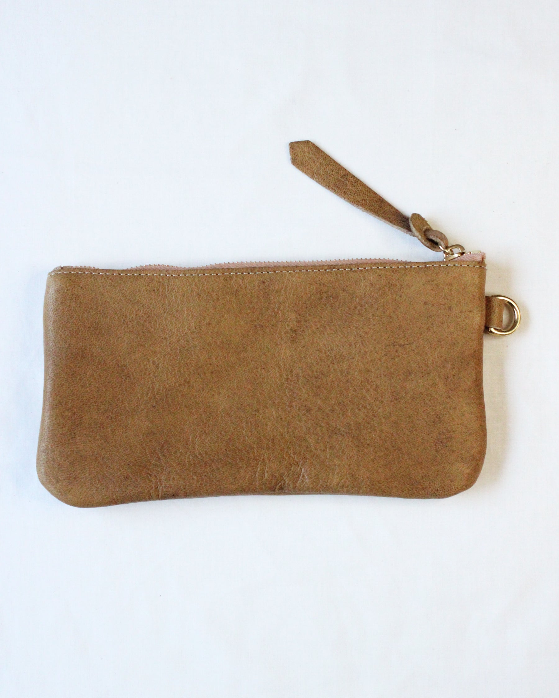 Brown acorn-shaped zip pouch from BAY TINE TANNERY featuring a secure zipper closure and compact design.