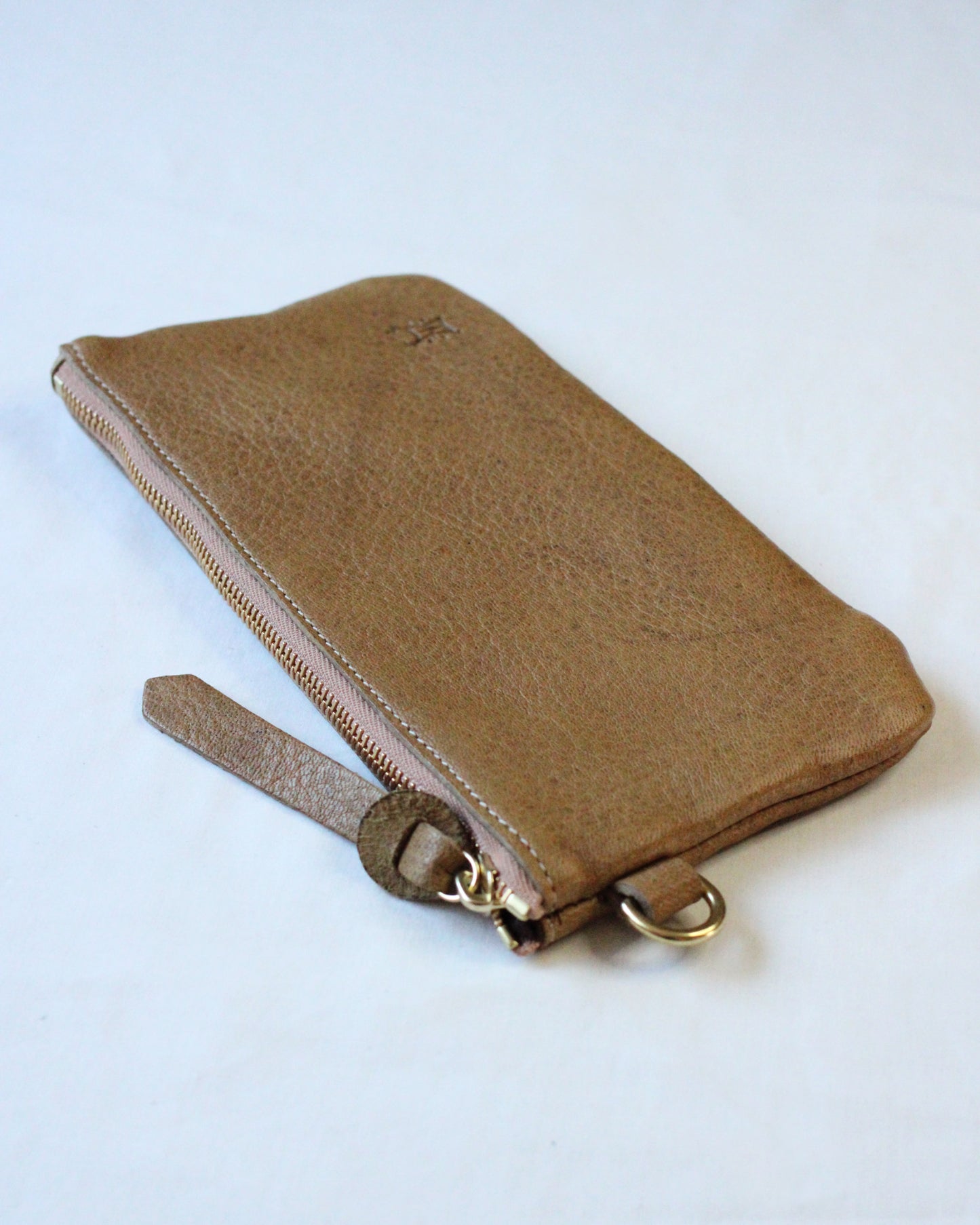 Brown acorn-themed zip pouch by BAY TINE TANNERY with a secure zipper closure and compact design.