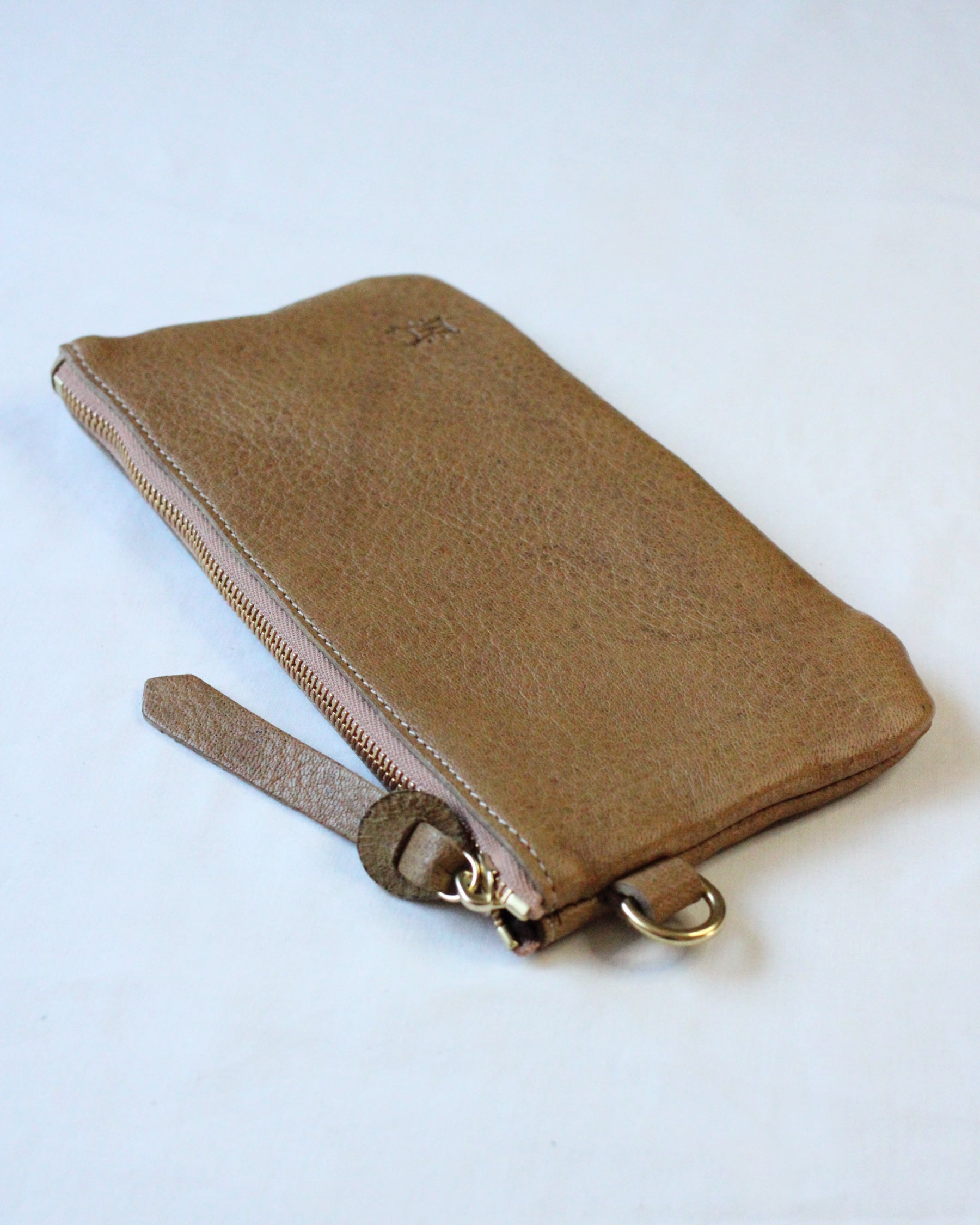 Brown acorn-themed zip pouch by BAY TINE TANNERY with a secure zipper closure and compact design.