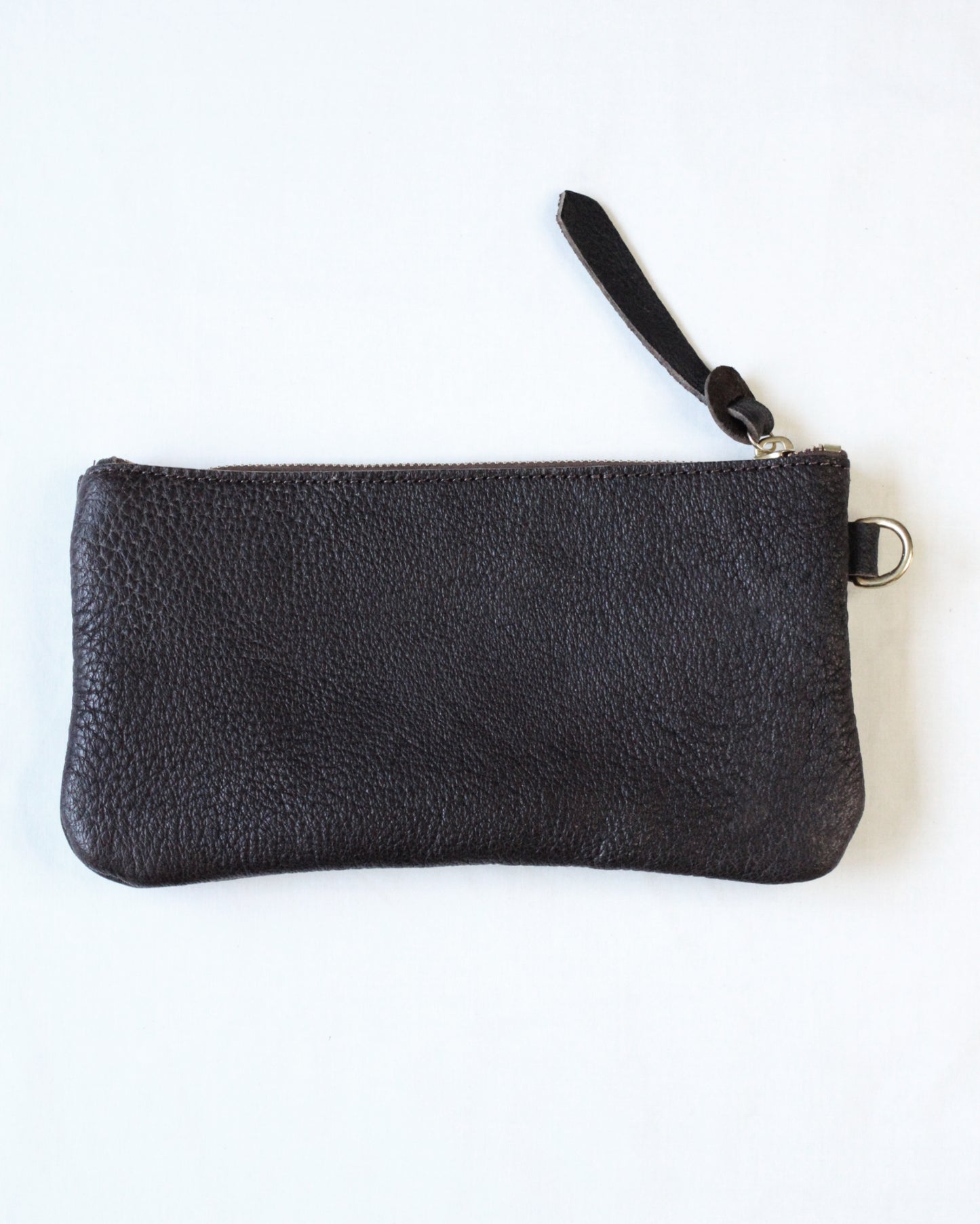 Brown leather zip pouch from BAY TINE TANNERY with a compact design and sturdy zipper closure.