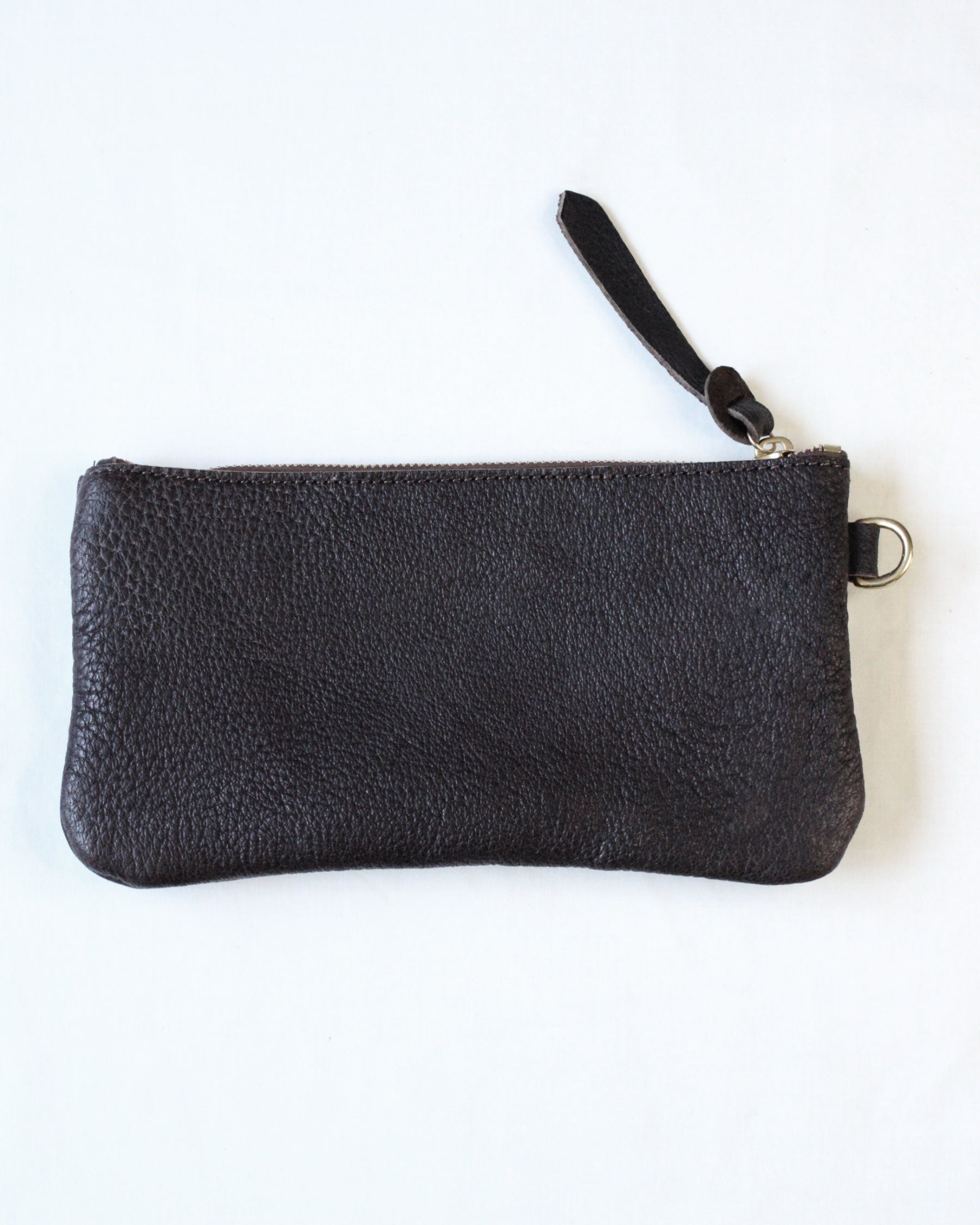 Brown leather zip pouch from BAY TINE TANNERY with a compact design and sturdy zipper closure.